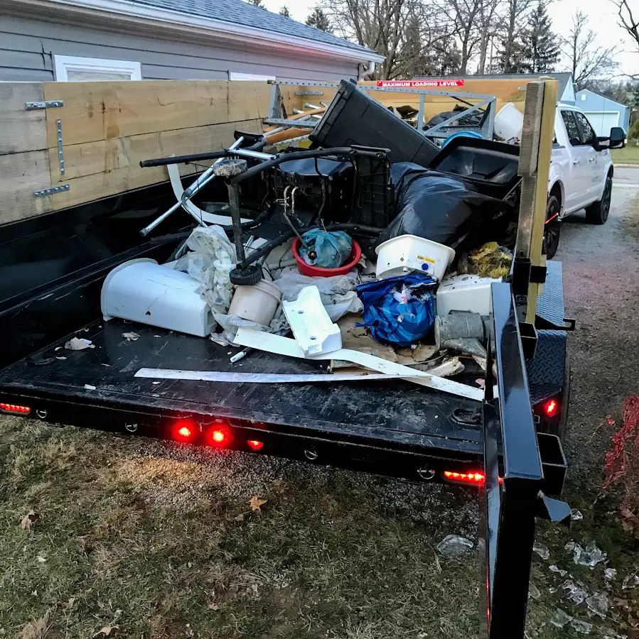 Roll-off dumpster delivered to a residential driveway in Candia